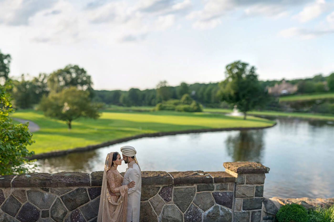 couple by stone wall