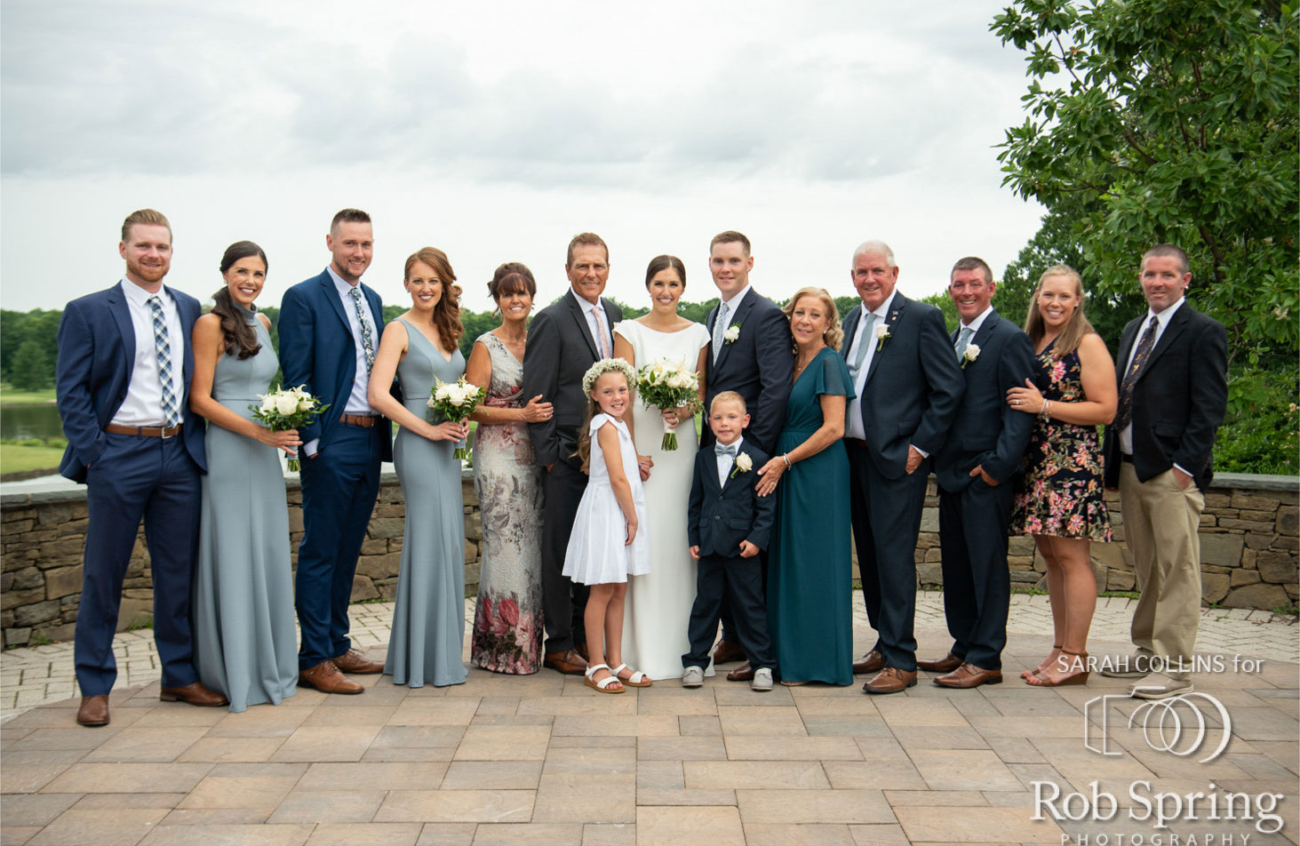 Bride and groom with family on Brooklake terrace